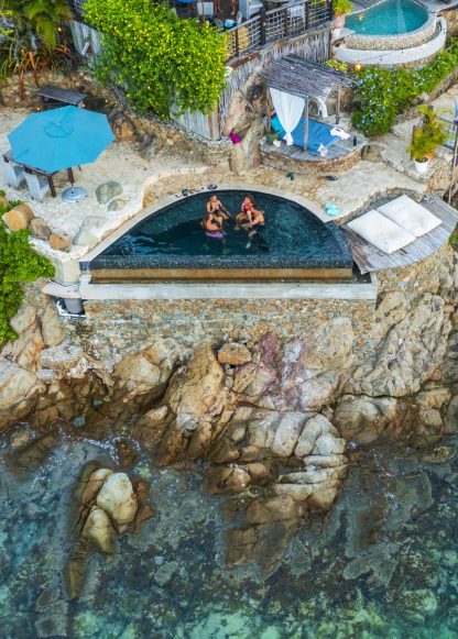 Aerial view of 2 couples in rock pool